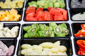 Fresh Vegetables and Fruits sliced in Salad Bar buffet