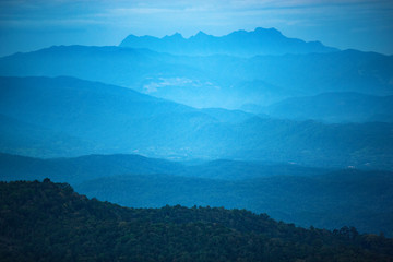 Layers of blue color mountains during sunset