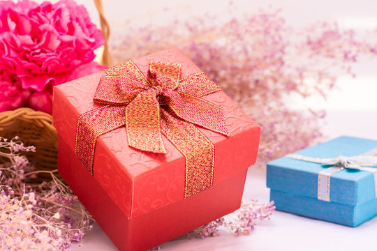gift box with ribbon and bow on wooden background