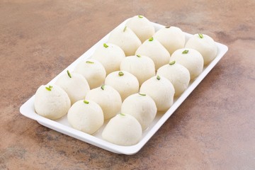 Indian Sweet Rasgulla Also Know as Rosogolla, Roshogolla, Rasagola, Ras Gulla, Anguri Rasgulla or Angoori Rasgulla is a Syrupy Dessert Popular in India. It is Made From Ball Shaped Dumplings