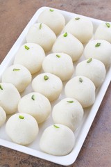 Indian Sweet Rasgulla Also Know as Rosogolla, Roshogolla, Rasagola, Ras Gulla, Anguri Rasgulla or Angoori Rasgulla is a Syrupy Dessert Popular in India. It is Made From Ball Shaped Dumplings