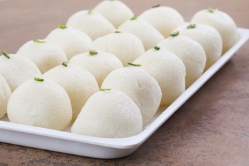 Indian Sweet Rasgulla Also Know as Rosogolla, Roshogolla, Rasagola, Ras Gulla, Anguri Rasgulla or Angoori Rasgulla is a Syrupy Dessert Popular in India. It is Made From Ball Shaped Dumplings