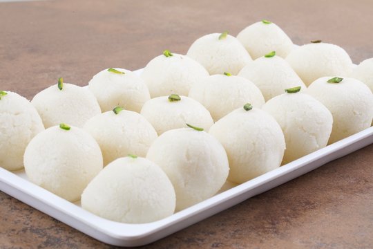 Indian Sweet Rasgulla Also Know as Rosogolla, Roshogolla, Rasagola, Ras Gulla, Anguri Rasgulla or Angoori Rasgulla is a Syrupy Dessert Popular in India. It is Made From Ball Shaped Dumplings
