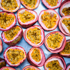 ripe fresh organic passion fruit background , half cut