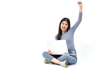 woman sitting floor holding laptop