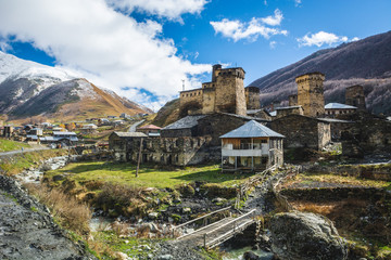Picturesque landscape of aged Georgian rural community Ushguli in valley of beautiful mountains with snowy peaks