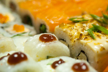 close up  fresh juicy delicious sushi set. view from the outside. for design and decor. selective focus. background texture.