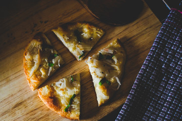 home made pizza and topping with coconut .