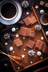 Home-made milk chocolate, sliced, top view, selective focus