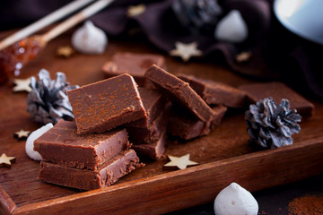Homemade chocolate, sliced with a cup of coffee, top view, horizontal