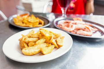 Roast Potatoes with herbs on the table in restaurant
