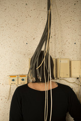 A hidden head behind electric cables