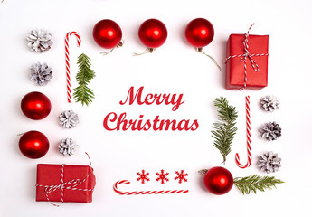 Christmas greeting message with decorations and gifts on white background.