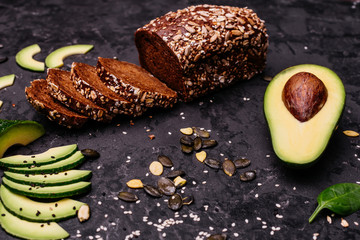 Food, avocado, healthy food. Avocado and brown bread. It can be used as a background