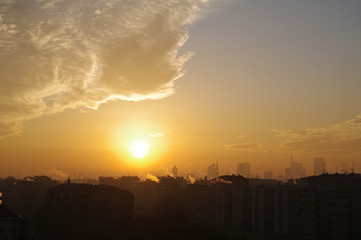 sunset in milan,italy,sky, sun, clouds,evening, cloud, orange,yellow, light,skyline,horizon,city,winter  