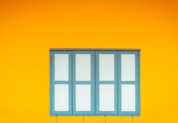 vintage window in the yellow wall