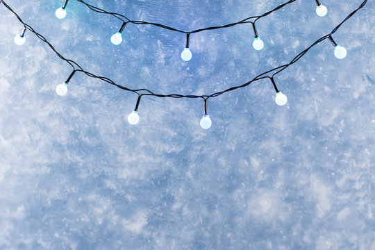 Christmas Lights Over Dark Blue Winter Background, Copyspace