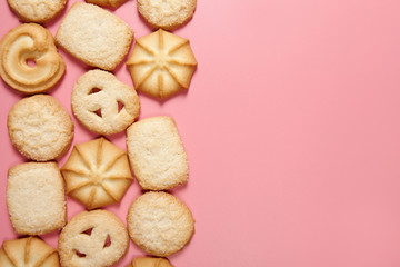Danish butter cookies on pink background with copy space. Top view.