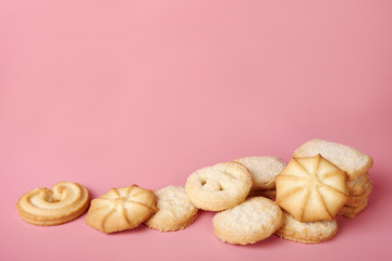 Danish butter cookies on pink background with space for your text.