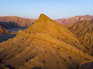 Fototapeta na wymiar Sandstone desert rock scenery at dusk