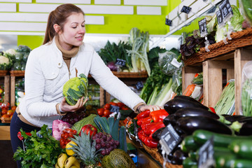 Young woman in greengrocery
