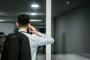 businessman talking on mobile phone in the office