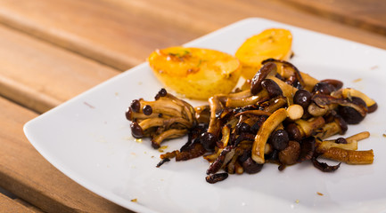 Delicious  cooked fried shitake mushrooms with young potatoes