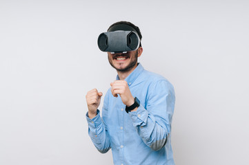 Photo of excited man for new round in virtual fighting game