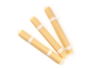 A photo of three individually wrapped portions of udon noodles, shot from the top on a white background with a place for text