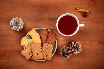 Traditional German Christmas Spekulatius cookies, almond biscuits, with spices and hot chocolate, shot from above with copy space