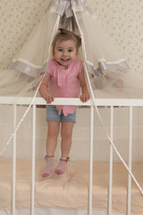 Young kid playing on a floor in a room