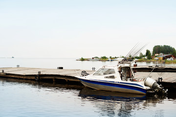 Fishing trolling boat on a forest lake, nature vacation unplugged