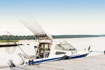 Fishing trolling boat on a forest lake, nature vacation unplugged