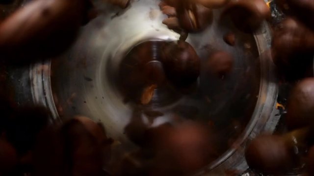 Electric coffee grinder works. Slow motion. High angle view.
