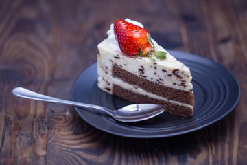 Chocolate and cheese cake on distressed wood background