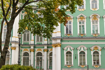 Obraz premium Green old building facade on a restored majestic russian building