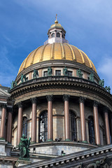Fototapeta na wymiar Saint Isaac Cathedral golden dome on a blue sky in Saint Petersburg