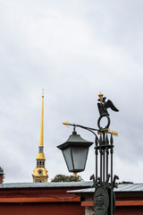 Architectural detail of golden peaks, lamps, towers in Saint Petersburg