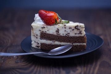 Chocolate and cheese cake on distressed wood background