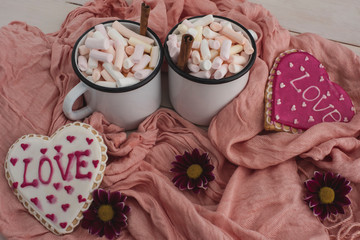 Romantic breakfast for valentine day. A delicious drink of marshmallows and heart-shaped cookies....