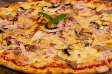 Pizza with ham and mushrooms