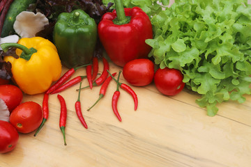 Closeup of organic fresh vegetables  on wooden table. Preparation for healthy food cooking. 