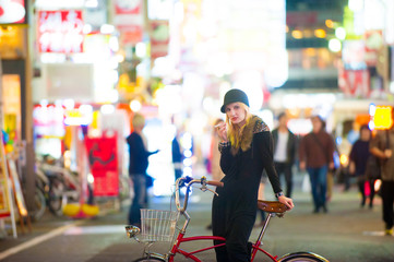 Caucasian female model poses for pictures on the street