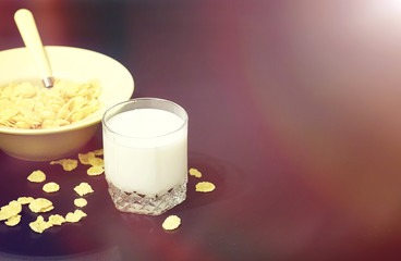 Corn flakes in a plate. Breakfast from flakes with honey and milk. Fast breakfast with corn flakes.