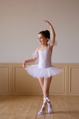 Little girl ballerina in a white tutu
