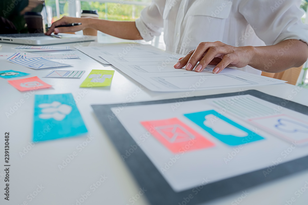 Wall mural creative web designer planning application and developing template layout, framework for mobile phon