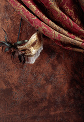 Old masquerade Venetian carnival mask with feathers and rhinestones.