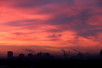 Fototapeta na wymiar Urban industrial building on background of dawn