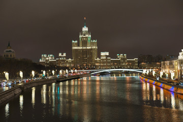 Fototapeta na wymiar Bright Moskva-river embankment at the winter night