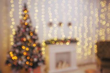 Christmas tree and holiday decorations. Blured defocused background
